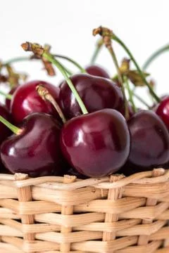 Full basket of red cherries on a stem close up Stock Photos