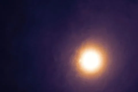 Full Beaver Moon on dark cloud on the night sky Stockfoto's