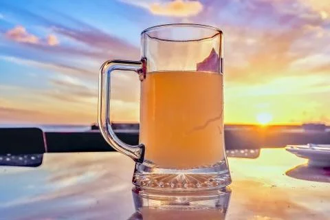 Full of beer humps in backlight in closeup Stock Photos
