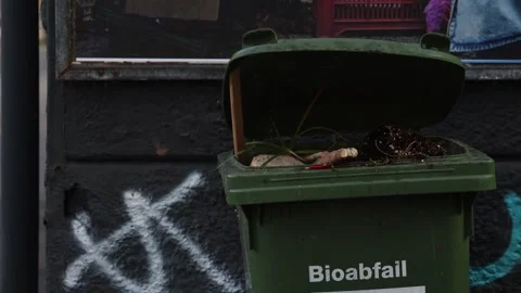 Full Bio trash garbage container with "bio trash" sign in German Video stock 321852492