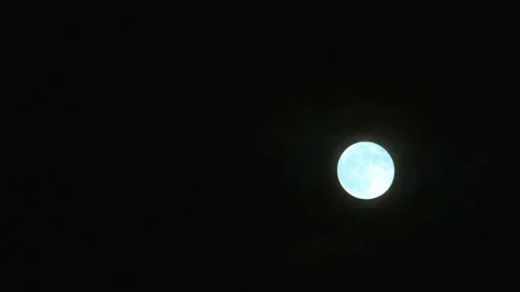Full blue flower moon on the night sky time lapse Stock Footage 273428877