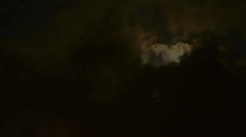 Full Blue Moon rises in moving clouds time lapse medium zoom HD 1080 Stock Footage 27562718