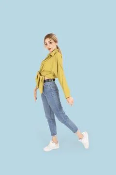 Full body length side view young woman posing. Stock Photos