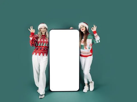 Full body portrait of young two woman show ok gesture big phone mock up Stock Illustration