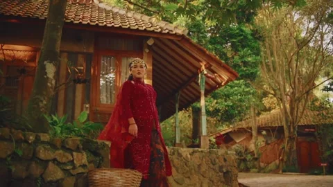 Full Body Shot of Javanese Bride Exiting Traditional House Stock Footage 274840863