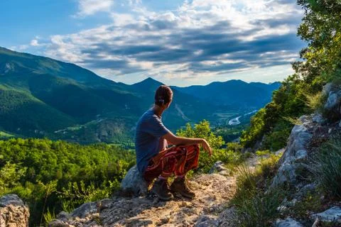 A full body shot of a thoughtful unrecognizable young Caucasian redhead hiker Stock Photos
