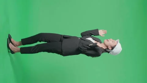 Full Body Side View Of Smiling Asian Female Engineer With Safety Helmet Dancing Stock Footage 186116361