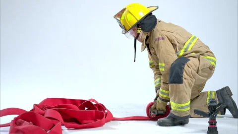 Full-body studio portrait of a firefighter in protective uniform Video stock 326218633