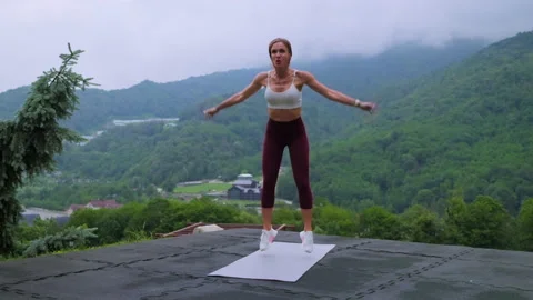 Full-body workout with burpees. Training in the mountains Stock Footage 168260228