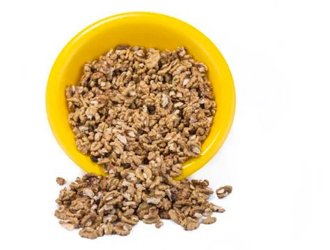 Full bowl of walnuts on the white background Stock Photos