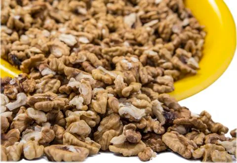 Full bowl of walnuts on the white background Stock Photos