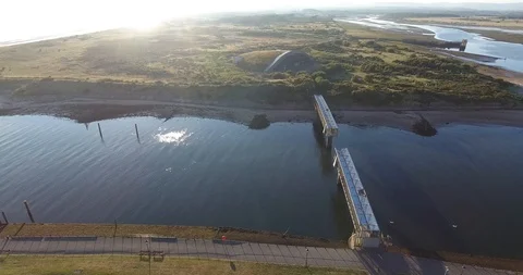 Full Bridge Between Scottish Islands Drone Shots at Sun Down 動画素材 97526867