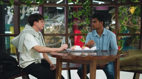 Full cafeteria view with friends discussing over meal Vídeo Stock 318251347