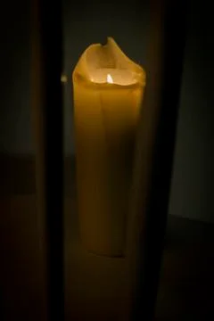Full candle in the dark Stock Photos