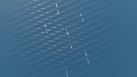 Full carrier strike group from high altitude aerial deep blue ocean open wat Video stock 343734845