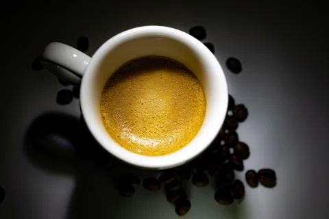 Full coffee cup on dark background Stock Photos