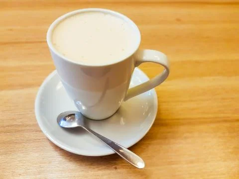 Full coffee mug on the table Stock Photos
