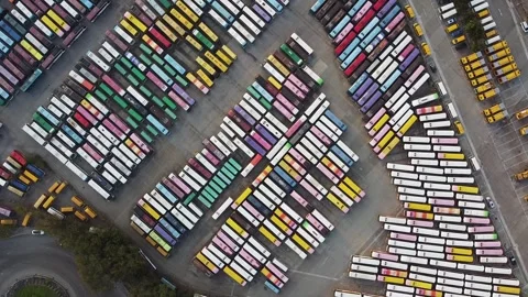 Full of Colorful Cute Bus Parking - Aerial Footage Top Down View Stock Footage 246304549