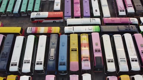 Full of Colorful Cute Bus Parking - Aerial Footage Top Down View Stock Footage 246304559