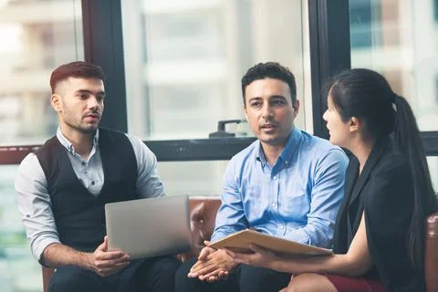 Full concentration at work. Group of young business people working. Foto stock