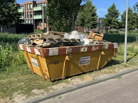 Full construction waste container Stock Photos