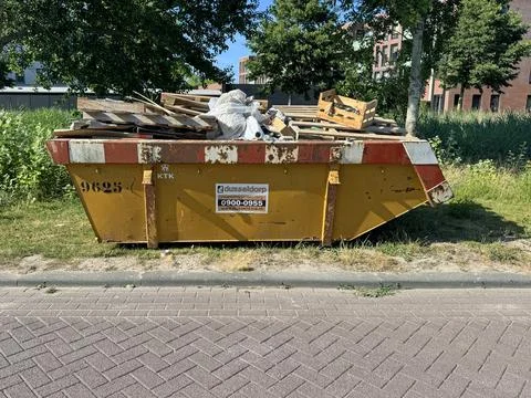 Full construction waste container Stock Photos
