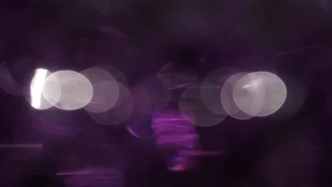 Full coverage of prismatic purple bokeh glowing light flares in black Stockbeeldmateriaal 318944773