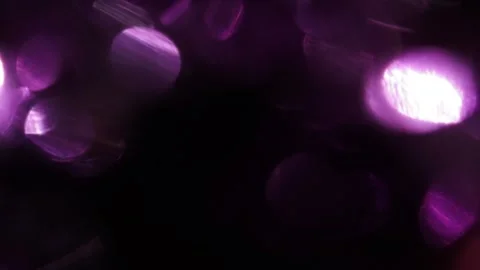 Full coverage of purple bokeh glowing light flares in black Stockbeeldmateriaal 318945860