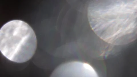 Full coverage of white bokeh glowing light flares in black 動画素材 318915210