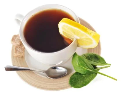Full cup of tea with lemon Stock Photos