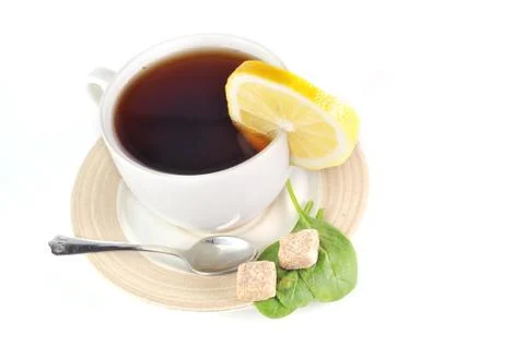 Full cup of tea with lemon Foto stock