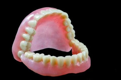Full denture on black background Stock Photos