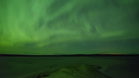 Full diffuse Norther Lights by lake Stock Footage 250289226