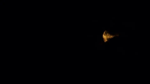 Full fiery moon behind black clouds. Black ominous clouds float 스톡 동영상 245384155