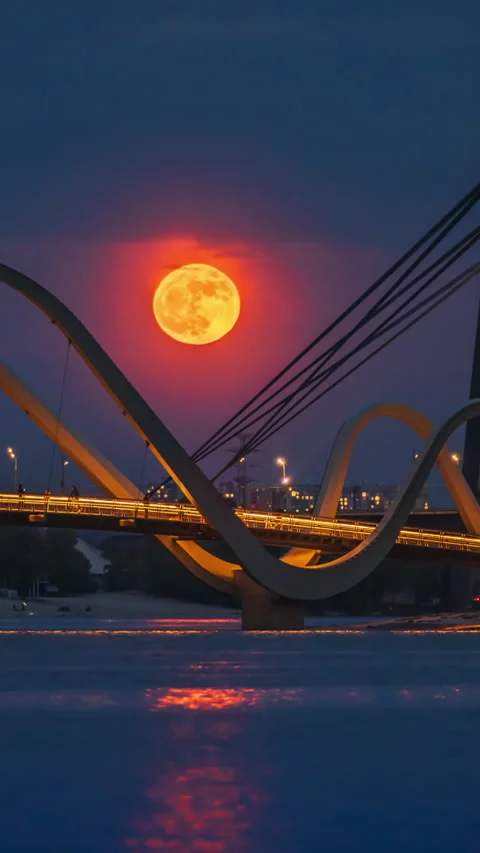 The full Flower Moon rises over the pedestrian bridge in Kyiv, Ukraine Stock Footage 309205219
