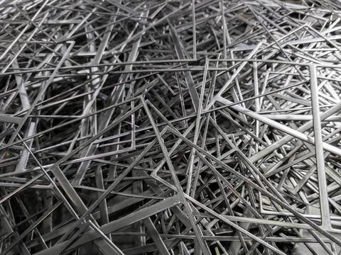 Full frame abstract industrial background of stamping leftovers pile, close-up Stockfoto's