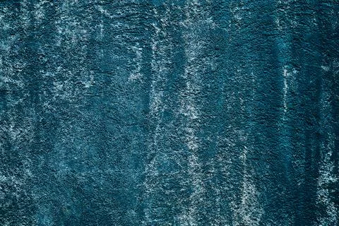 Full frame abstract texture of a weathered deep blue wall with vertical wat.. Fotos Stock