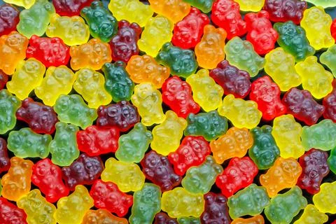 Full-frame background and texture pattern of colorful jelly bears laid closely Foto stock