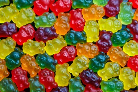 Full-frame background and texture pattern of colorful jelly bears laid closely Foto stock