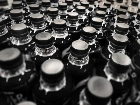 Full Frame Background of Black Bottled Beverage Stock-Fotos