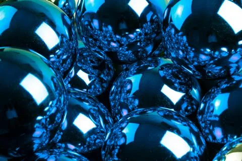 Full frame background of blue mirror balls close-up with selective focus Stock Photos