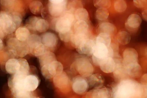 Full frame background blurred copper or rose colour bokeh image Stock Photos