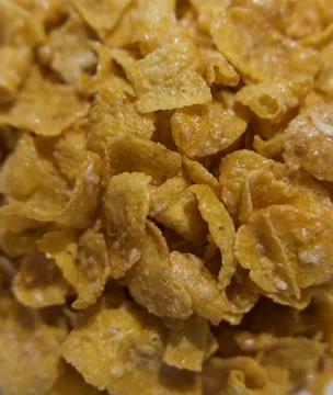 Full frame background close up image of golden sugary breakfast cereal Stock Photos