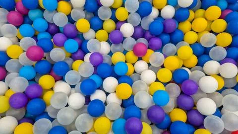 Full-frame background of colorful plastic balls in a ball pit viewed from above. Stock Photos