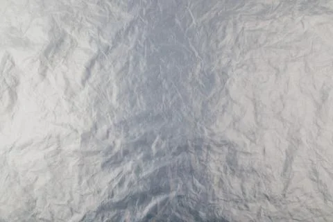 Full frame background of flat crumpled semi-transparent polyethylene film Stock Photos
