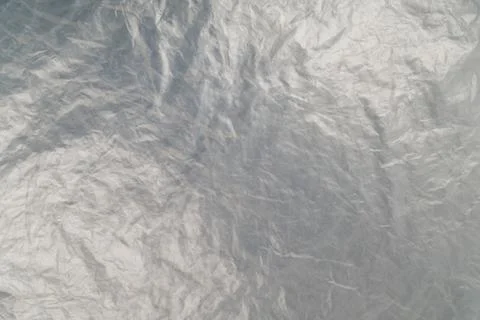Full frame background of flat crumpled semi-transparent polyethylene film Photos