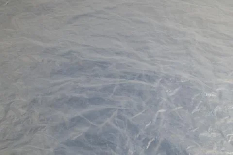 Full frame background of flat crumpled semi-transparent polyethylene film Photos