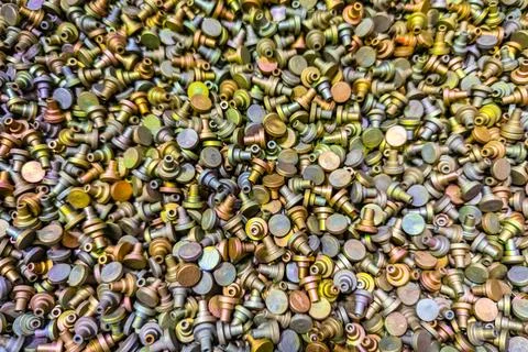 Full-frame background of iridescent Cadmium chromate plated parts 写真素材