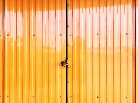 Full Frame Background of Locked Corrugated Yellow Shutter Door Stock Photos