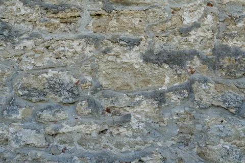 Full frame background of old historical stone wall texture with mortar Stock Photos